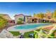 Backyard pool area with ample seating, mature landscaping, and room for outdoor activities and entertaining at 2150 Maple Heights Ct, Henderson, NV 89052