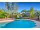 Backyard pool with desert landscaping, featuring an outdoor seating area perfect for relaxation and entertaining at 2150 Maple Heights Ct, Henderson, NV 89052