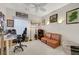 Comfortable bedroom with a sofa, artwork, and desk at 2150 Maple Heights Ct, Henderson, NV 89052