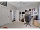 Bedroom featuring double door closet, light walls, a desk and office chair at 2150 Maple Heights Ct, Henderson, NV 89052