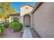 A charming front entryway with beautiful drought-resistant landscaping and warm curb appeal at 2150 Maple Heights Ct, Henderson, NV 89052