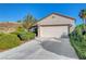 Charming single-story home with a two-car garage and well-manicured landscaping at 2150 Maple Heights Ct, Henderson, NV 89052