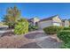 Single-story home is highlighted by desert landscaping, enhancing curb appeal and reducing maintenance at 2150 Maple Heights Ct, Henderson, NV 89052