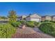 Single-story home boasts xeriscaping, adding to the charm and low-maintenance appeal at 2150 Maple Heights Ct, Henderson, NV 89052