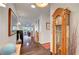 Elegant hallway with hardwood floors, decorative accents, and a traditional grandfather clock at 2150 Maple Heights Ct, Henderson, NV 89052