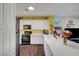 Bright kitchen features white cabinets, stainless steel appliances, and a modern countertop, perfect for cooking and entertaining at 2150 Maple Heights Ct, Henderson, NV 89052
