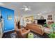 Open concept living room with hardwood floors connecting to the kitchen at 2150 Maple Heights Ct, Henderson, NV 89052