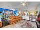 Stylish living room with a comfortable leather sofa and an open view to the kitchen, perfect for entertaining at 2150 Maple Heights Ct, Henderson, NV 89052