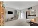 Bright living room featuring television, slider to backyard and view of bath at 2150 Maple Heights Ct, Henderson, NV 89052