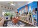 Cozy living room with hardwood floors, blue accent wall, and natural light at 2150 Maple Heights Ct, Henderson, NV 89052