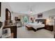 Relaxing main bedroom featuring a ceiling fan, tv and neutral tones at 2150 Maple Heights Ct, Henderson, NV 89052