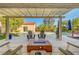 Inviting outdoor patio with pool, lounge chairs and a fire pit at 2150 Maple Heights Ct, Henderson, NV 89052
