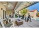 Inviting outdoor patio with pool, lounge chairs and a fire pit at 2150 Maple Heights Ct, Henderson, NV 89052