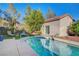 Private pool with a sleek design and sparkling water, offering a relaxing retreat in a landscaped backyard at 2150 Maple Heights Ct, Henderson, NV 89052