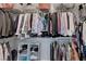 Walk-in closet with metal shelving, hanging rods, and neatly organized clothing at 2150 Maple Heights Ct, Henderson, NV 89052