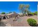 Desert landscaped backyard featuring rocks, shrubs, and fencing at 2508 Chasma Dr, Henderson, NV 89044