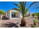 Backyard with desert landscaping, palm trees, rock accents, patio and fence at 2508 Chasma Dr, Henderson, NV 89044