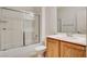 Well-lit bathroom featuring a shower-tub combo, single sink vanity and toilet at 2508 Chasma Dr, Henderson, NV 89044
