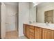 Bathroom featuring a double vanity, glass enclosed shower, and open walk in closet at 2508 Chasma Dr, Henderson, NV 89044