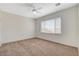 Spacious bedroom featuring a ceiling fan and a window offering natural light at 2508 Chasma Dr, Henderson, NV 89044