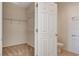 Walk-in closet, showcasing metal shelving and doorway to the bathroom at 2508 Chasma Dr, Henderson, NV 89044