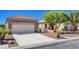 Inviting single-story home with stone accents, desert landscaping, and a convenient two-car garage at 2508 Chasma Dr, Henderson, NV 89044