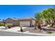 Single-story home with desert landscaping and a stone facade, complemented by a spacious two-car garage at 2508 Chasma Dr, Henderson, NV 89044