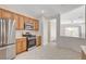 Modern kitchen featuring stainless steel appliances and view into living area at 2508 Chasma Dr, Henderson, NV 89044