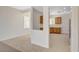 View of the living room and kitchen with tile flooring and modern finishes at 2508 Chasma Dr, Henderson, NV 89044