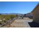 Backyard view with chain link fence and mountain views at 2520 E Ambush St, Pahrump, NV 89048