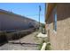 View of a backyard featuring chain link fence and desert landscape at 2520 E Ambush St, Pahrump, NV 89048