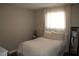 Bright bedroom with a sunlit window, comfortable bed, and decorative accents at 2520 E Ambush St, Pahrump, NV 89048