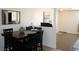 Dining room with dark wood furniture and access to other living spaces at 2520 E Ambush St, Pahrump, NV 89048