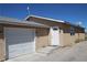 Garage attached to desert home with an entry door at 2520 E Ambush St, Pahrump, NV 89048