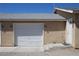 Garage door and entry door of desert home at 2520 E Ambush St, Pahrump, NV 89048