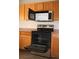 Modern kitchen boasting stainless steel oven and microwave, with natural-finish cabinetry at 2520 E Ambush St, Pahrump, NV 89048