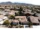 Expansive aerial view of a well-maintained single-Gathering home with desert landscaping and mountain views at 2585 Portsmouth Creek Ave, Henderson, NV 89052