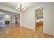 Inviting dining area showcases a stylish chandelier and easy access to the living room and kitchen at 2585 Portsmouth Creek Ave, Henderson, NV 89052