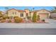 Charming single-story home featuring a low-maintenance xeriscaped front yard and a tile roof at 2585 Portsmouth Creek Ave, Henderson, NV 89052