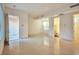 Spacious living room with tile floors, flooded with natural light, providing access to other rooms at 2585 Portsmouth Creek Ave, Henderson, NV 89052