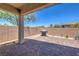 Backyard with covered patio, brick-paved area, grill, and privacy wall at 326 Zenith Crest St, Henderson, NV 89015