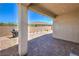 Covered patio overlooks a brick-paved backyard, perfect for outdoor living at 326 Zenith Crest St, Henderson, NV 89015