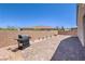 Brick patio, BBQ grill, and desert landscaping enhance this backyard's appeal at 326 Zenith Crest St, Henderson, NV 89015