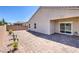 Spacious backyard featuring a brick patio, desert landscaping, and privacy wall at 326 Zenith Crest St, Henderson, NV 89015