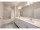 Elegant bathroom with double sinks, modern fixtures, and a separate shower and tub at 326 Zenith Crest St, Henderson, NV 89015