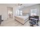 Bright bedroom featuring neutral tones, a ceiling fan, and a comfortable king size bed at 326 Zenith Crest St, Henderson, NV 89015