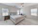 Inviting bedroom with large windows, neutral tones, and comfortable furnishings at 326 Zenith Crest St, Henderson, NV 89015