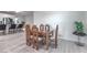 Contemporary dining area showcasing a glass-top table with seating for four, adjacent to the kitchen at 326 Zenith Crest St, Henderson, NV 89015