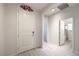 Bright entry way, with light floors, white walls, and decorative poinsettia at 326 Zenith Crest St, Henderson, NV 89015