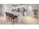 Stylish kitchen with stainless steel appliances, breakfast bar, and ample counter space at 326 Zenith Crest St, Henderson, NV 89015